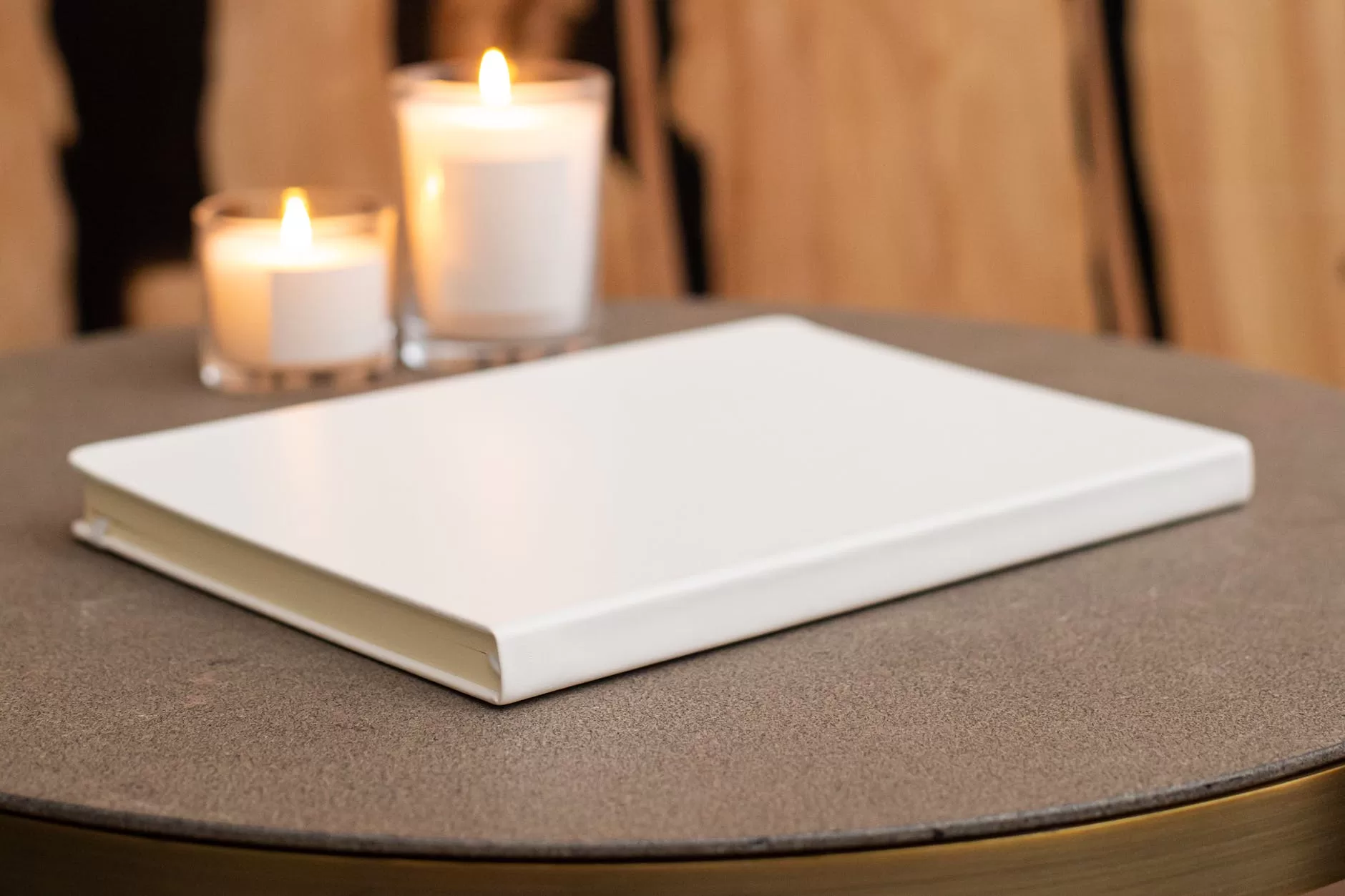 empty book on table with candles